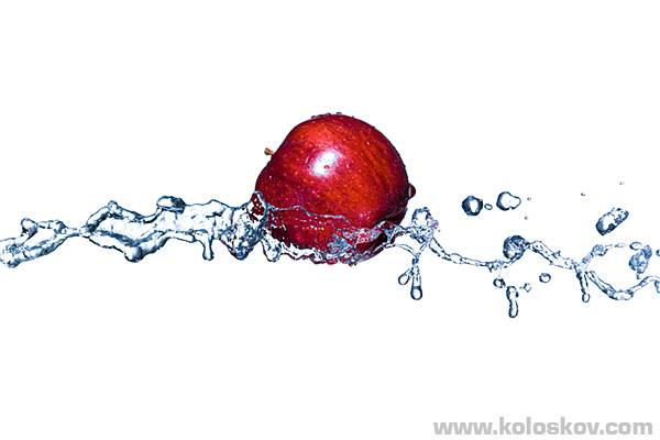 Red apple on wave Hith speed photography of red apple and water