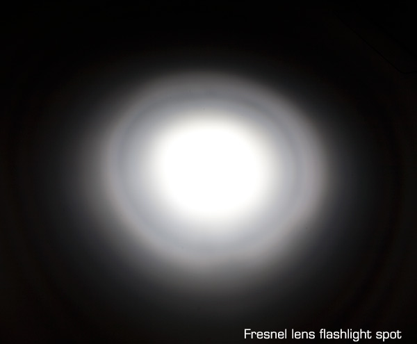 Fresnel lens flashlight beam projection.