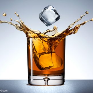 Glass of Whiskey with Splash and Ice Drop