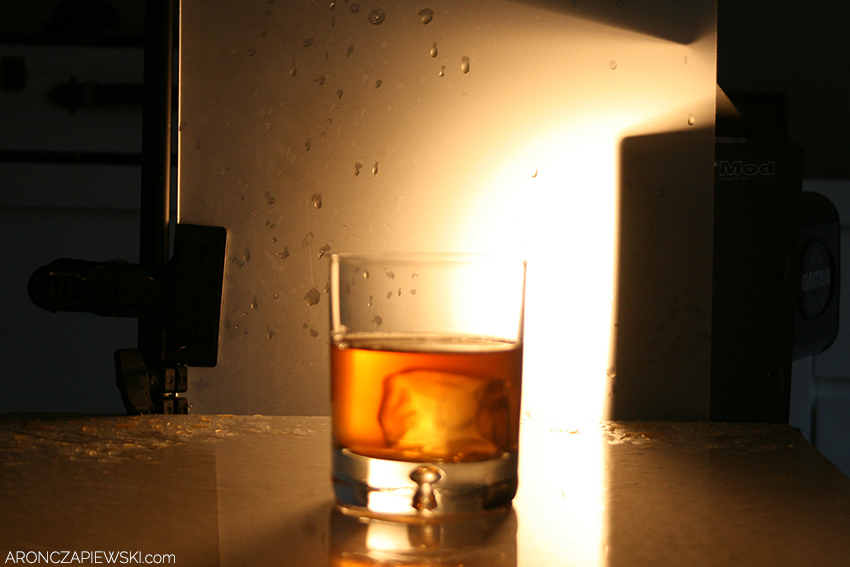 Glass of Whiskey with Splash and Ice Drop