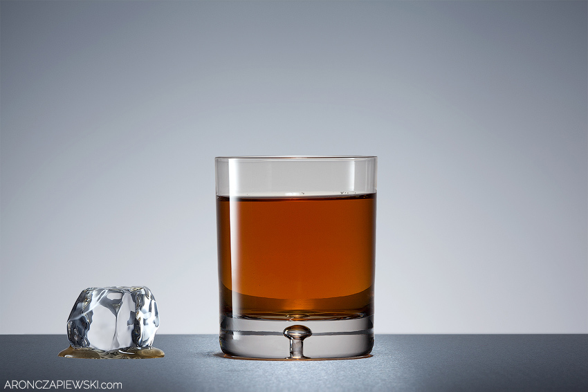 Glass of Whiskey with Splash and Ice Drop
